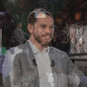 Man in Suit Standing in Front of Crowd