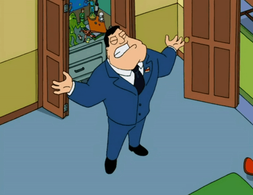 Man in Suit Standing in Front of Door