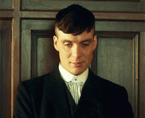 Man In Suit Standing In Front Of Door GIF