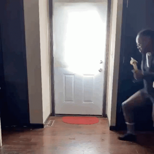 Man in Suit Standing in Front of Door