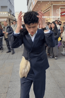 Man in Suit Standing in Front of Minkookhairstudio