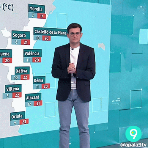Man in Suit Standing in Front of Temperature Map