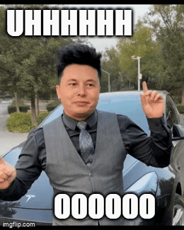 Man in Suit Standing in Front of Tesla Model T