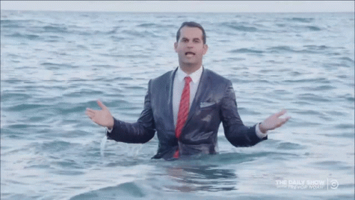 Man in Suit Standing in Water Daily Show