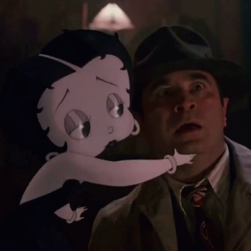 Man in Suit Standing Next to Betty Boop