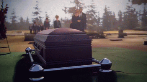 Man In Suit Standing Next To Coffin GIF