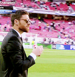 Man in Suit Standing on Soccer Field