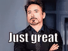 Man In Suit Standing With Arms Crossed Saying Just Great GIF