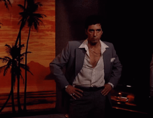 Man in Suit Standing with Hands on Hips