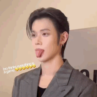 Man in Suit Sticking Tongue Out