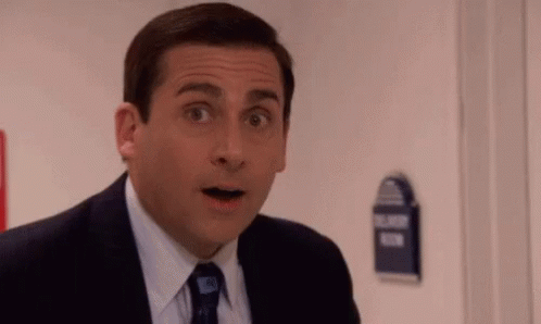 Man in Suit Surprised in Front of Door