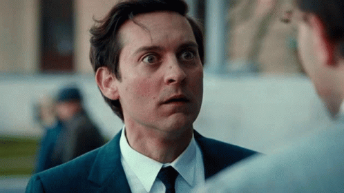 Man in Suit Surprised Talking to Another Man