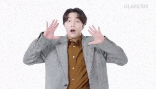 Man in Suit Surprised with Hands