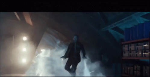 Man in Suit Surrounded by Smoke