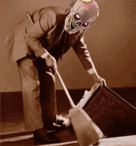 Man in Suit Sweeping with Zombie Mask