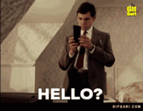 Man In Suit Taking Selfie Saying Hello GIF