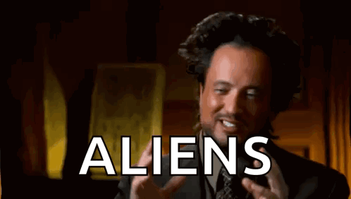 Man In Suit Talking About Aliens And Funny Face GIF