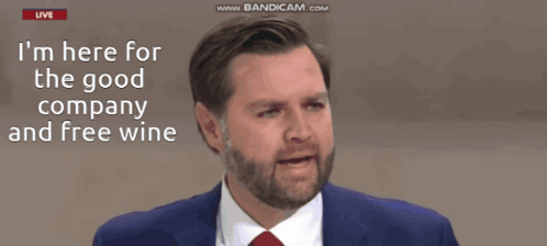 Man in Suit Talking About Company and Free Wine