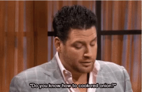 Man in Suit Talking About Cooking Red Onion on TV