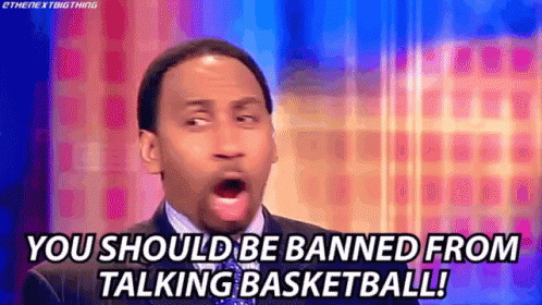 Man in Suit Talking Basketball