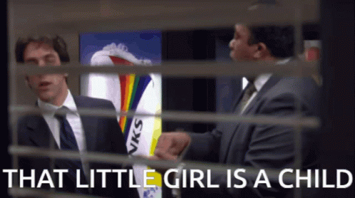 Man in Suit Talking Behind Girl