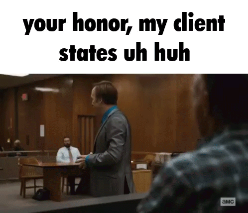 Man in Suit Talking in Courtroom