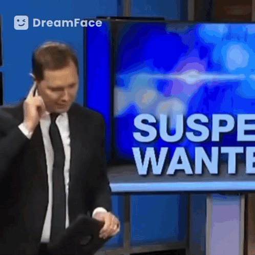 Man in Suit Talking on Cell Phone