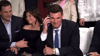Man In Suit Talking On Cell Phone GIF