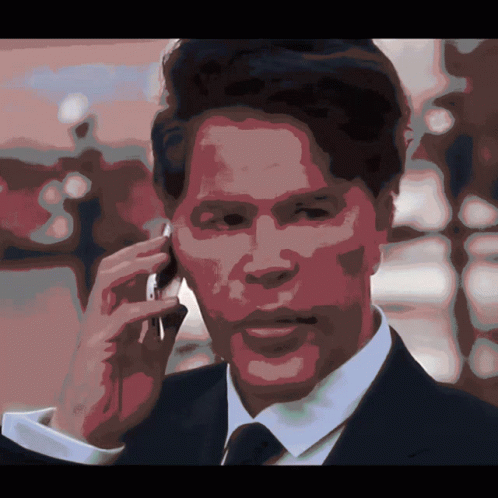 Man In Suit Talking On Cell Phone GIF