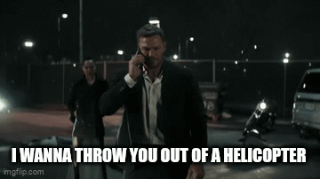 Man In Suit Talking On Cell Phone While Walking GIF