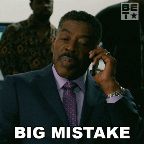 Man in Suit Talking on Phone Saying Big Mistake
