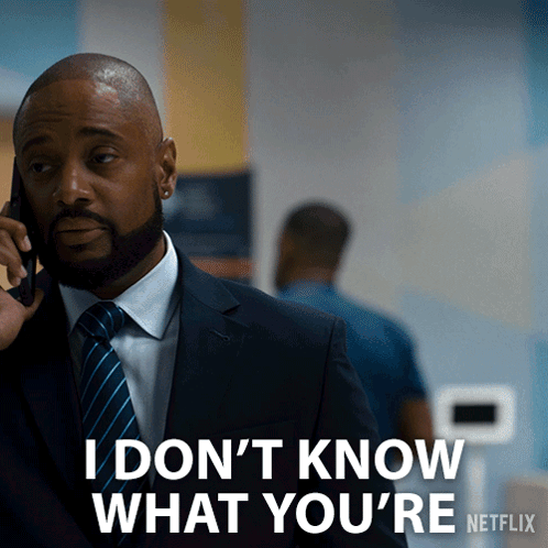 Man in Suit Talking on Phone