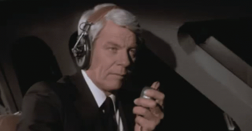 Man in Suit Talking on Walkie Talkie Roger