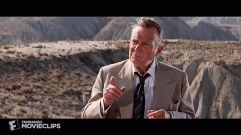 Man In Suit Talking To Another Man GIF