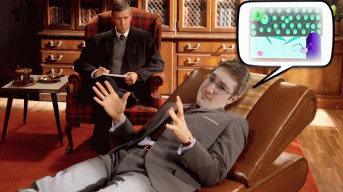Man in Suit Talking to Another Man