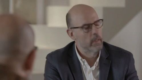 Man In Suit Talking To Another Man GIF