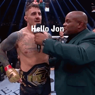 Man in Suit Talking to Boxer