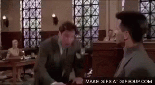Man in Suit Talking to Man