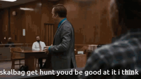 Man in Suit Talking to Man Skalbag Get Hunt