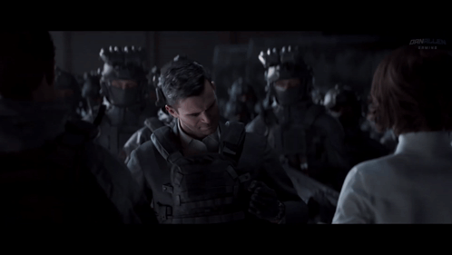 Man in Suit Talking to Woman Before Soldiers
