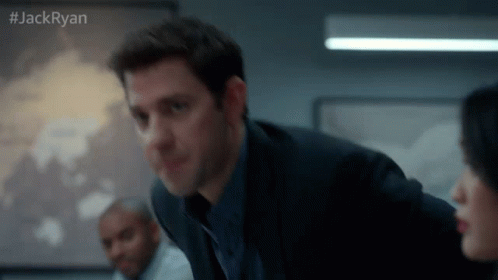 Man in Suit Talking to Woman in Conference Room #jackryan