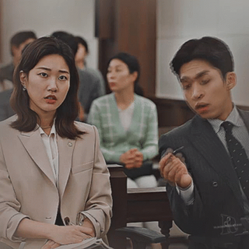 Man In Suit Talking To Woman In Suit GIF