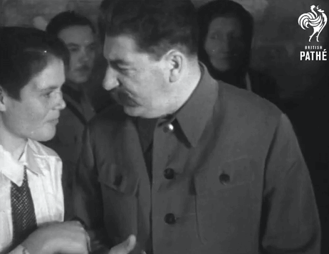 Man In Suit Talking To Woman GIF