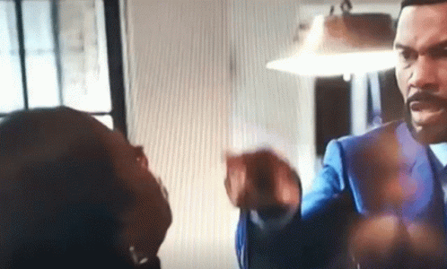Man In Suit Talking To Woman GIF