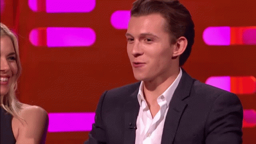 Man In Suit Talking To Woman On Red Background GIF