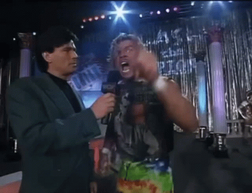 Man In Suit Talking To Wrestler Saying Ever GIF