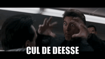 Man in Suit Talking with Cul de Deesse Text