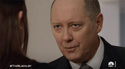 Man In Suit Talks To Woman #Theblacklist GIF