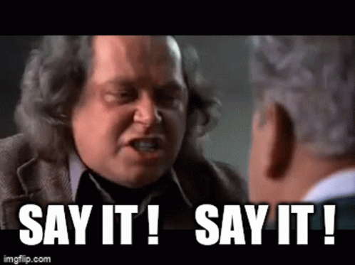 Man in Suit Telling Say It