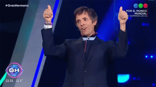 Man in Suit Thumbs Up Gran Hermano